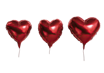 Three vibrant red heart-shaped balloons against a stark black backdrop, slightly inflated