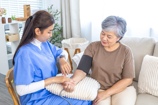 Caregiver nurse checking blood pressure of senior patient at home, measuring pulse and monitoring health in calm environment, professional healthcare, warm, and supportive medical assistance