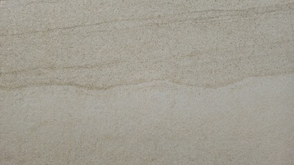 The white stone tile walls have beautiful stone-like patterns and gradients of grey and white. The building walls are decorated with tiles, textures, and backgrounds of the tiles.