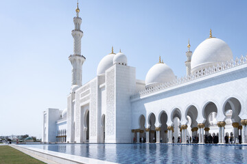 Front view of beautiful white marble mosque with minaret, United Arab Emirates