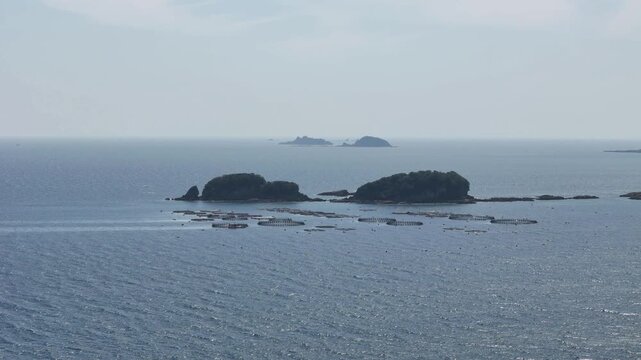 長崎県長崎市、五島灘の風景を空撮しました。遠くに軍艦島が見えます。