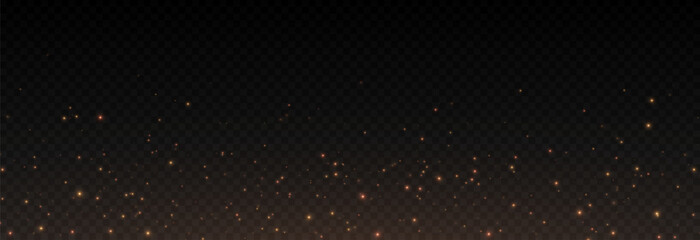 Golden glowing magic dust on a transparent background. Flying light particles PNG. Glowing dust PNG.