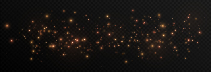 Golden glowing magic dust on a transparent background. Flying light particles PNG. Glowing dust PNG.