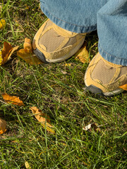 Yellow Sneakers Blue Jeans Autumn Grass Closeup