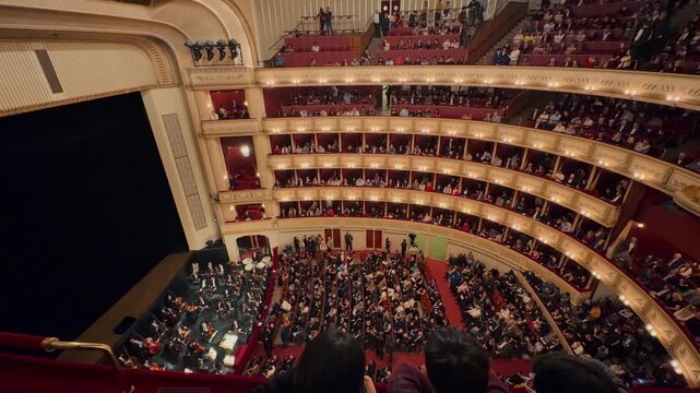 Exploring the majestic Vienna State Opera Clips showcase the opulent, gold-trimmed grand staircase, the historic exterior fa&ccedil;ade, and luxurious velvet theater boxes.