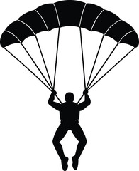 Silhouette of skydiver with open parachute descending