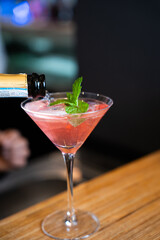 Pink Cocktail in Martini Glass with Mint