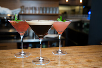 Three Elegant Cocktails in Martini Glasses