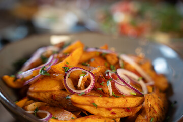 Spicy Potato Wedges with Red Onion Rings