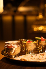 Indian Thali Meal with Chapati and Side Dishes