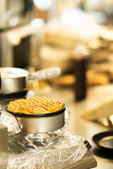 Freshly Baked Waffle in Iron – Close-Up