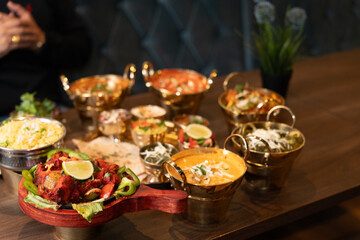 Traditional Indian thali meal with curries and bread