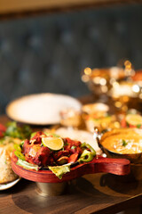 Indian Tandoori Chicken with Curry and Samosa