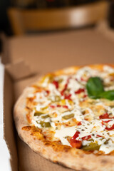 Fresh Pizza with Colorful Peppers in Box