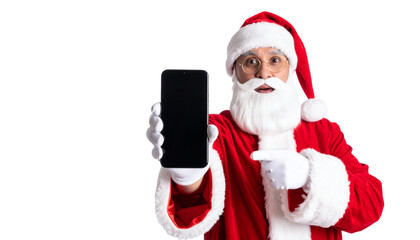 Naklejka premium Santa Claus showing a blank phone screen, perfect for your holiday message. He's dressed in his traditional attire and points towards the display, ready to deliver cheer