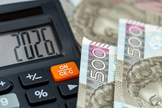 Poland money. Finances 2026. Business and economic concept. Symbol of the Polish zloty. The year 2026 displayed on a calculator. Financial background. Close up