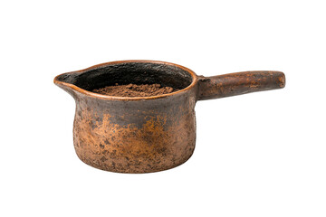 Vintage copper pot filled with coffee grounds, isolated on white background.