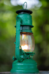 Antique green lantern glowing with soft warm light