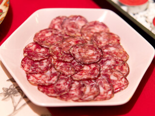 Close up of sliced spanish salchichon sausage.