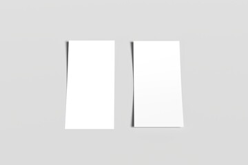 Minimalist composition with two blank white sheets of paper placed side by side on a light gray surface. Perfect for mockups, print design presentations, or background templates.