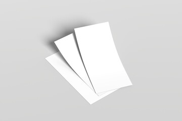 Minimalistic composition featuring three blank white sheets of paper arranged on a light gray surface. Perfect for mockups, stationery presentations, or design templates.