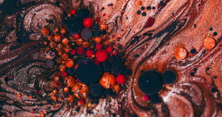Paint splatter. Glitter bubbles. Defocused orange red purple color sparkling round texture mix oil splash on abstract art background.