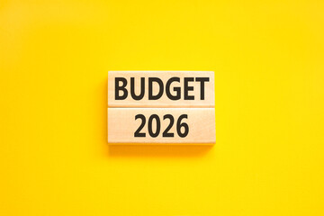 Budget 2026 symbol. Concept words Budget 2026 on beautiful wooden blocks. Beautiful yellow paper background. Business and budget 2026 concept. Copy space.