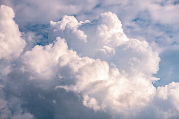 Expansive landscape featuring golden fields under a dramatic sky filled with clouds, showcasing the beauty of nature and tranquility in rural settings