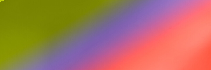 Abstract colorful gradient background with blurred green, purple, and red shades.