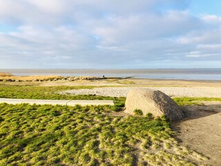 beautiful seascape of the relaxation hub of Dangast at the jade bay, germany. View of a winter afternoon at the end of december © MoniZ
