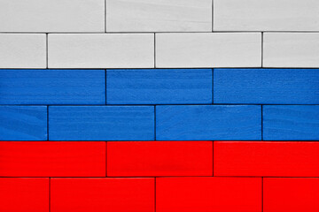 Wooden blocks arranged in the colors of the Russian flag create a vibrant symbolic representation