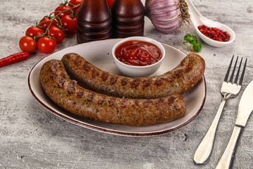 Grilled beef sausages with sauce