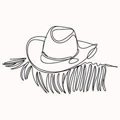 Continuous one line drawing of a classic Western cowboy hat resting on dry grass or hay