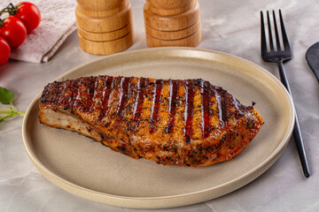 Grilled pork steak with bone