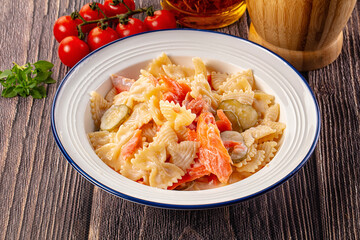 Italian pasta farfalle with salmon