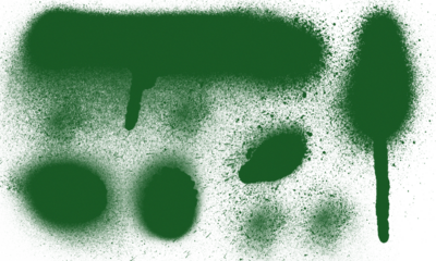 Abstract green spray paint splatters and drips on white background