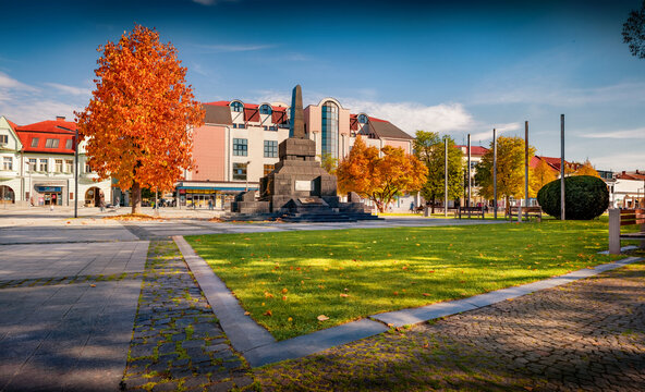 Colorful autumn view of empty Ludovit Sturat Park. Sunny morning cityscape of Zvolen town in central Slovakia, situated on the confluence of Hron and Slatina rivers. Traveling concept background.