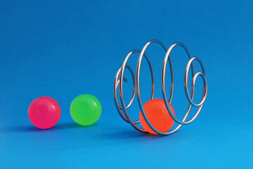 Finding a way out of a problem. A spiral that forms a sphere with a ball trapped while others are free