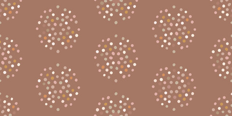 Seamless pattern of abstract scattered dots in pastel colors on a muted brown background