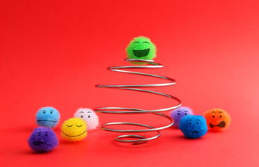 Plush sphere happy climbs a spiral while the group waits