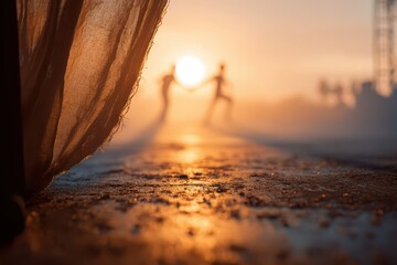 Hazy golden sunset silhouettes a couple holding hands, soft curtain.