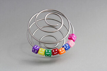 Cubes happy and together in a metal spiral