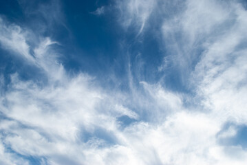 white clouds in a soft blue sky
