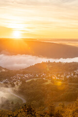 Sunrise over Rhine River near Bad Salzig in Germany with mist rising from the valley