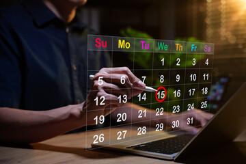 Calendar planning concept. Person using stylus to mark on virtual calendar, representing appointment scheduling, time management, event reminder, deadline, meeting agenda and effective work schedule.