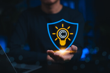 Intellectual property protection concept. Copyright icon inside lightbulb and shield. symbolizing legal services, copyright law, digital rights, innovation security and creative content protection.