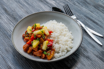 Chicken with pineapple in teriyaki sauce with fried rice. 
