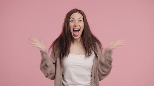 Surprised Pretty Woman Expresses Wow, Cant Believe. Impressed Lady On Pink 