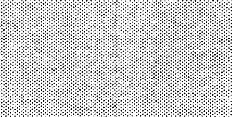 Evenly spaced black halftone dots with rough edges in a grunge style on a transparent background.