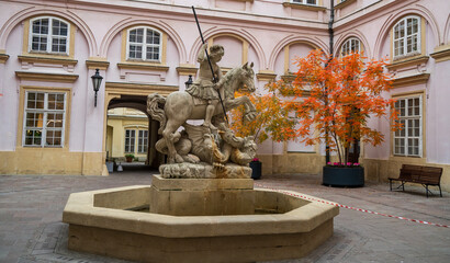 Pink walls and autumn trees at Primate's Palace in Bratislava